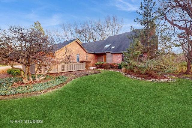 exterior space with a lawn and a deck