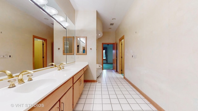 bathroom featuring tile patterned flooring and vanity