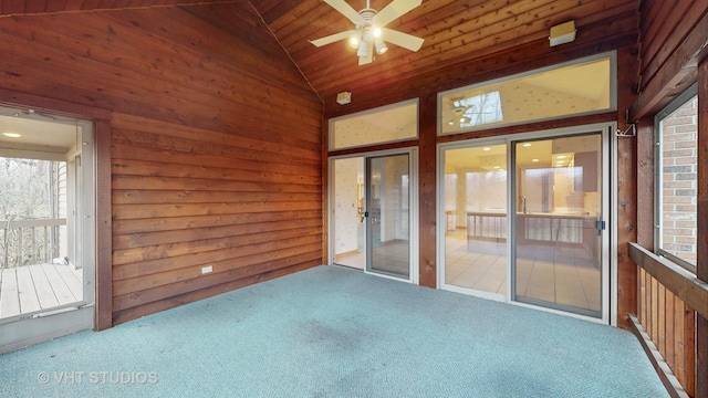 unfurnished sunroom with vaulted ceiling, ceiling fan, and wooden ceiling