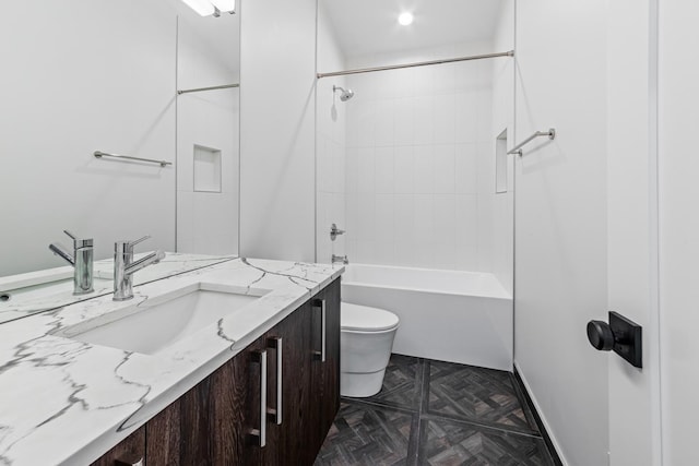 full bathroom with vanity, toilet, and tiled shower / bath combo