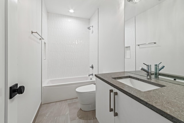 full bathroom with tiled shower / bath combo, vanity, and toilet