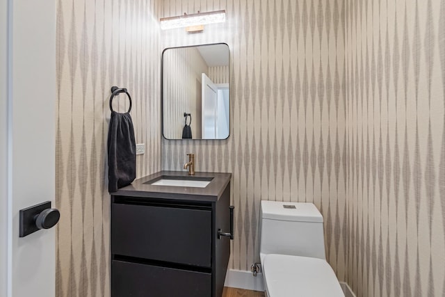 bathroom with vanity and toilet