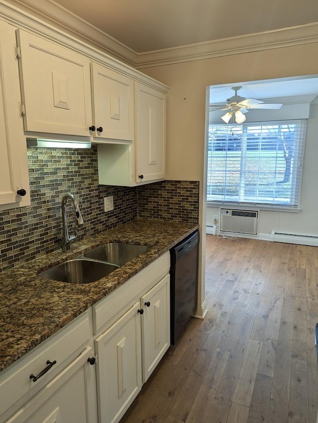 kitchen featuring dishwasher, sink, crown molding, wood-type flooring, and white cabinets