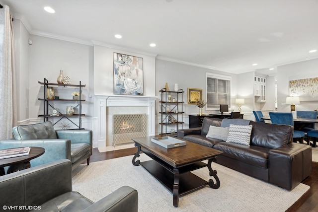 living room featuring hardwood / wood-style flooring and crown molding