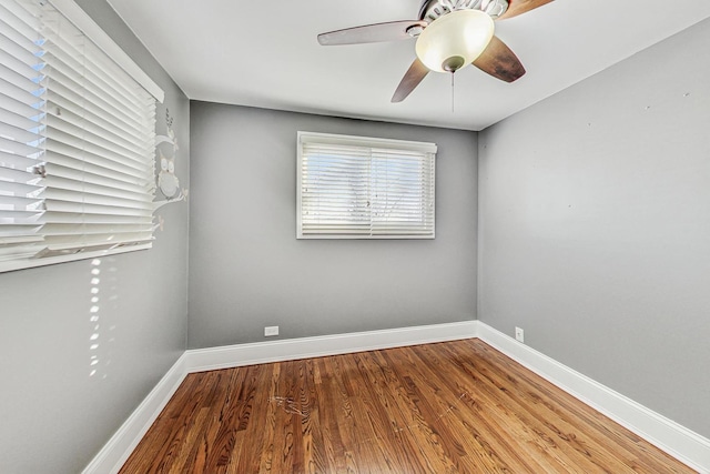 empty room featuring hardwood / wood-style floors and ceiling fan