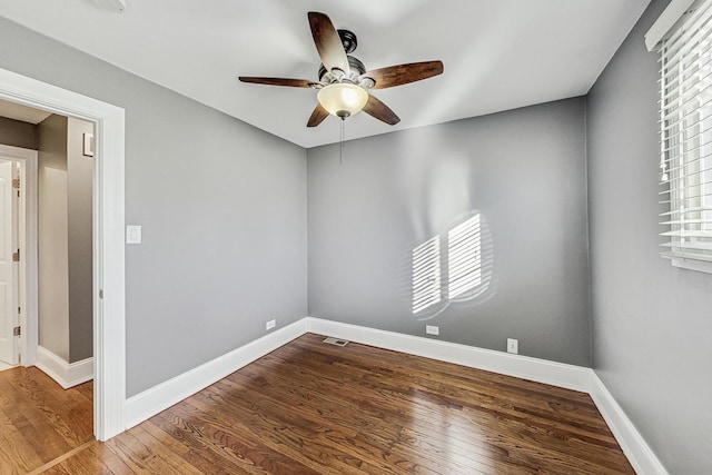 empty room featuring ceiling fan and wood-type flooring