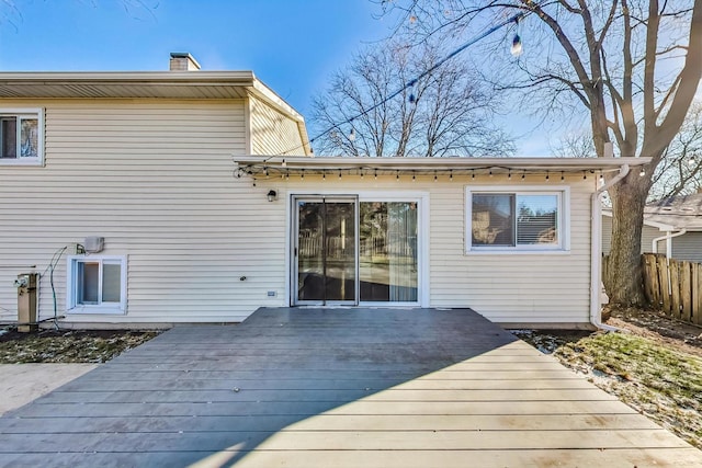 rear view of property with a wooden deck