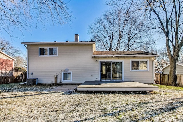 rear view of house with a deck and central air condition unit