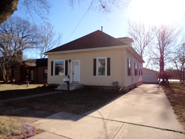 view of front of property featuring an outbuilding and a garage