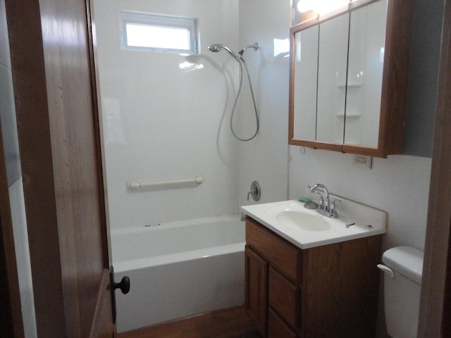 full bathroom with shower / bathing tub combination, hardwood / wood-style floors, vanity, and toilet