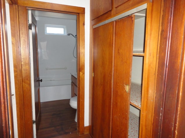 corridor featuring dark hardwood / wood-style floors