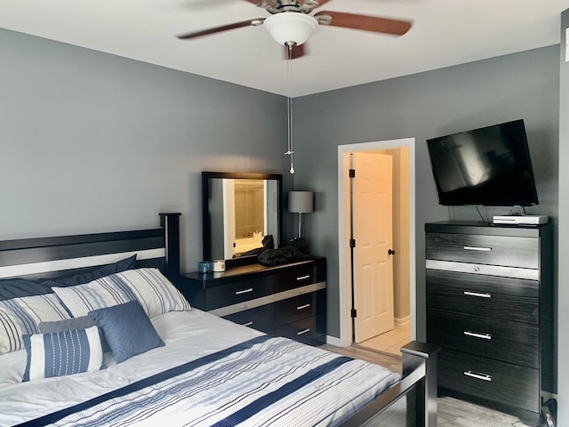 bedroom with ceiling fan and light hardwood / wood-style flooring