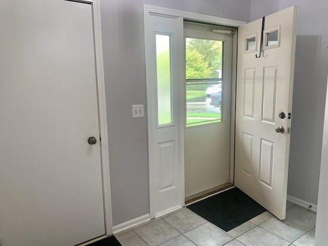 entryway with light tile patterned floors