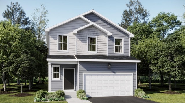 view of front of house featuring a front lawn and a garage