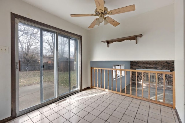 unfurnished room featuring ceiling fan and light tile patterned flooring