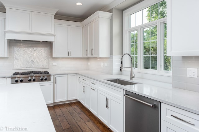 kitchen with white cabinets, dark hardwood / wood-style flooring, stainless steel appliances, and sink