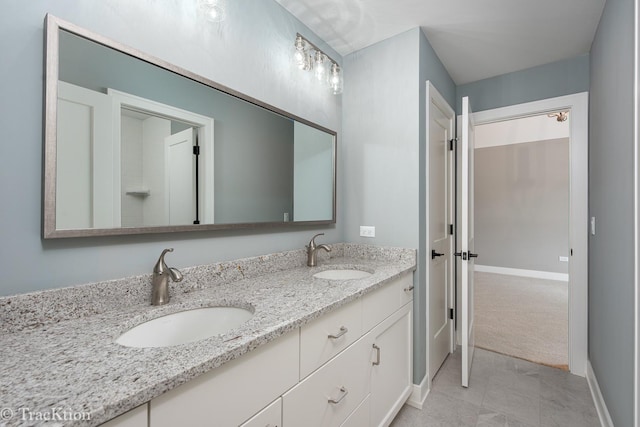 bathroom with tile patterned flooring and vanity