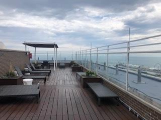 wooden deck with a water view