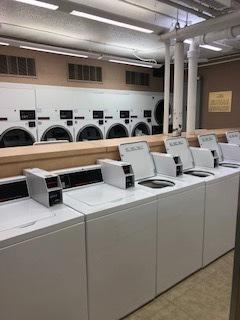 clothes washing area featuring separate washer and dryer