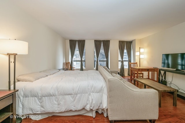 bedroom with hardwood / wood-style flooring