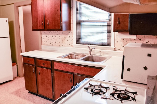 kitchen with sink and white appliances