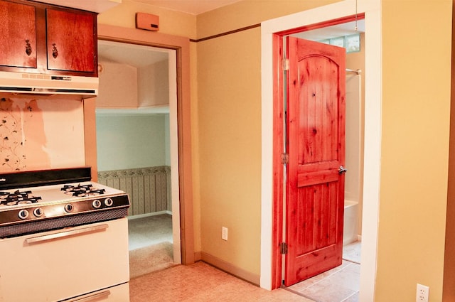 kitchen featuring white range oven