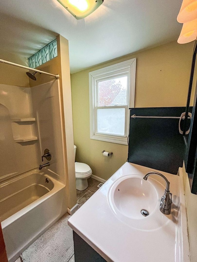 full bathroom with washtub / shower combination, vanity, and toilet