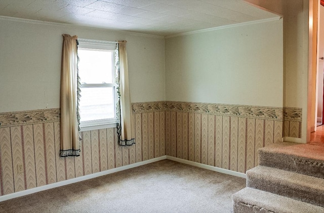 carpeted spare room with a textured ceiling and ornamental molding