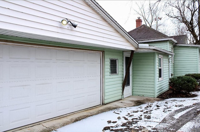 view of snow covered garage