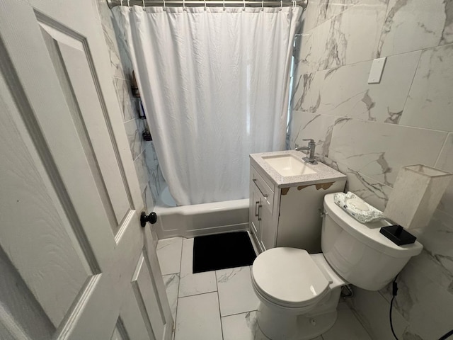 full bathroom with shower / tub combo, vanity, tile walls, and toilet