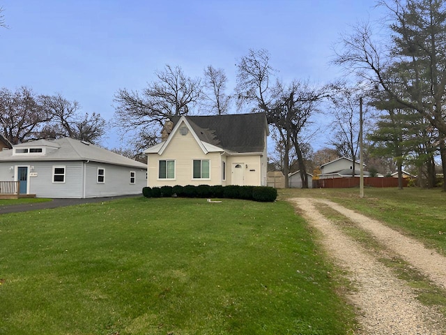 view of property exterior featuring a lawn