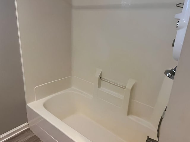 bathroom featuring a bathtub and wood-type flooring