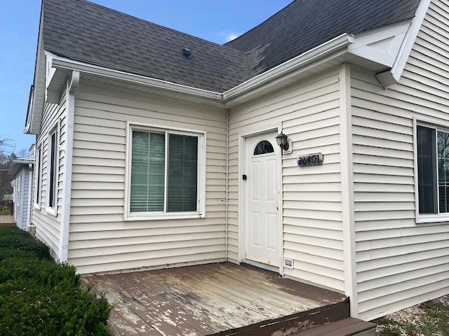 doorway to property with a wooden deck