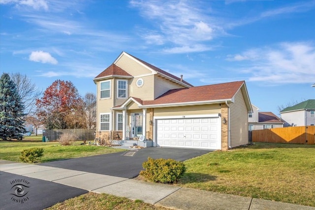 view of front of home featuring a front yard and a garage