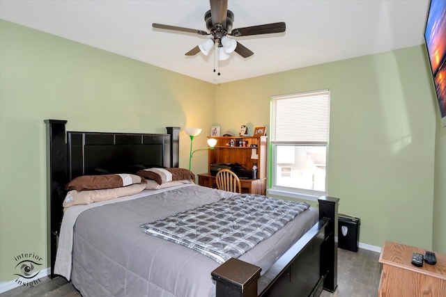 bedroom featuring ceiling fan and wood-type flooring