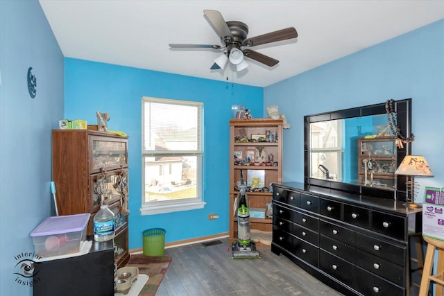 interior space with dark hardwood / wood-style floors and ceiling fan