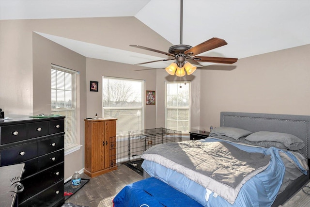 bedroom featuring hardwood / wood-style floors, ceiling fan, and vaulted ceiling