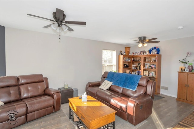 living room featuring hardwood / wood-style flooring and ceiling fan