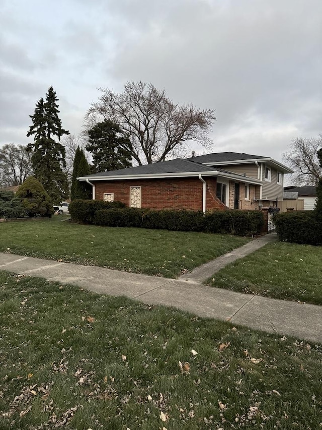 view of home's exterior featuring a lawn