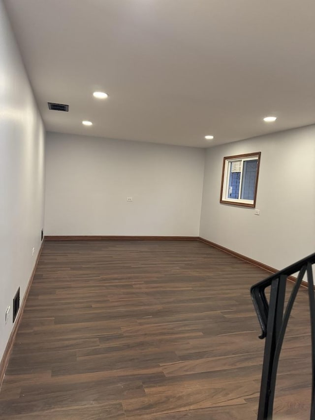 basement featuring dark wood-type flooring