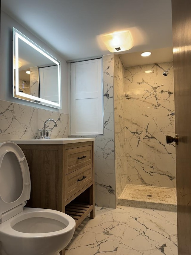 bathroom featuring a shower, vanity, and toilet