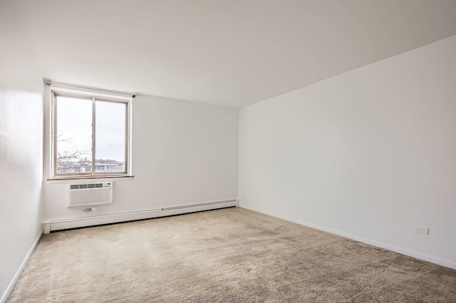 carpeted empty room featuring a wall unit AC and a baseboard radiator