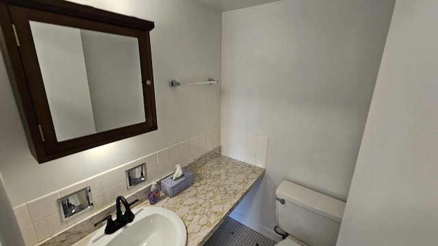 bathroom featuring tasteful backsplash, tile patterned flooring, vanity, and toilet