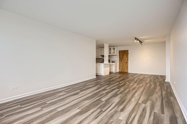 unfurnished living room featuring hardwood / wood-style floors