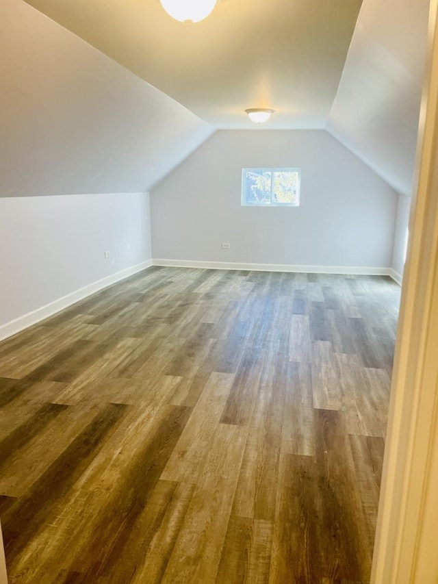 bonus room featuring hardwood / wood-style floors and lofted ceiling