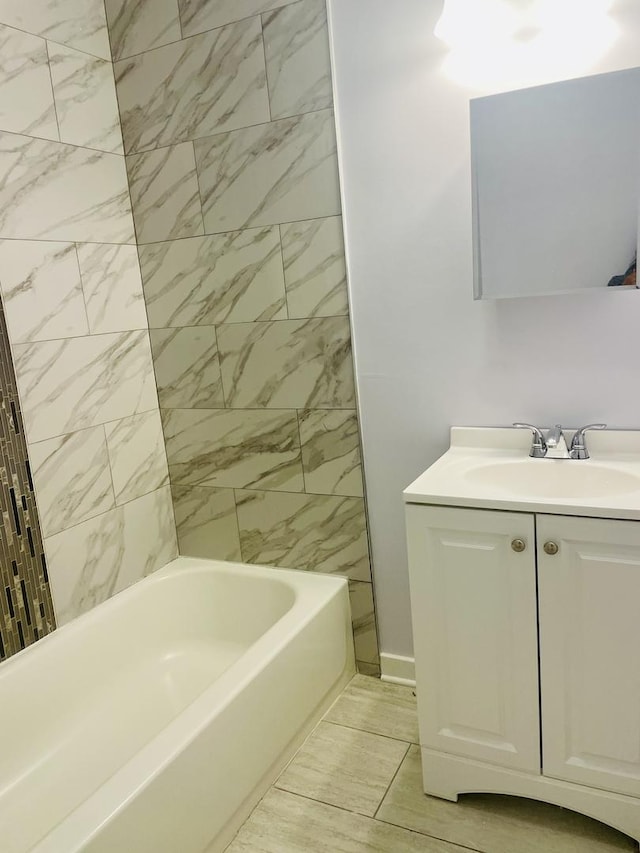 bathroom featuring vanity and bathing tub / shower combination