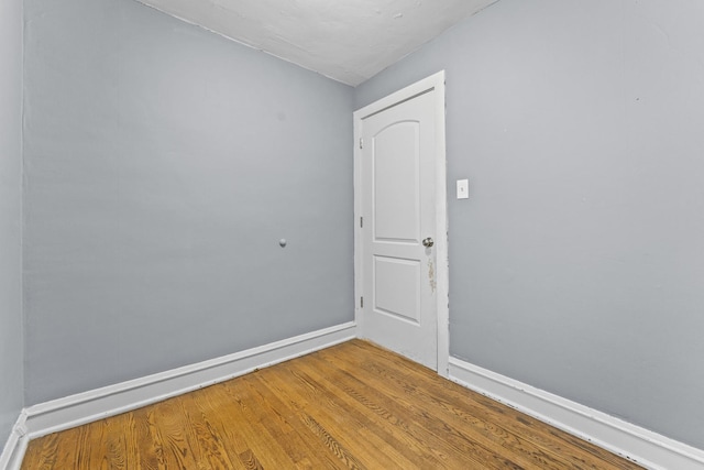 unfurnished room featuring hardwood / wood-style flooring