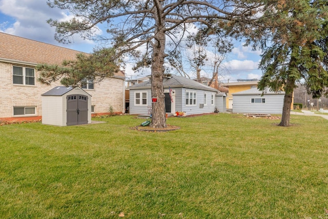 back of property featuring a shed and a yard