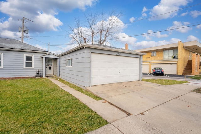 view of front of house with a garage and a front yard