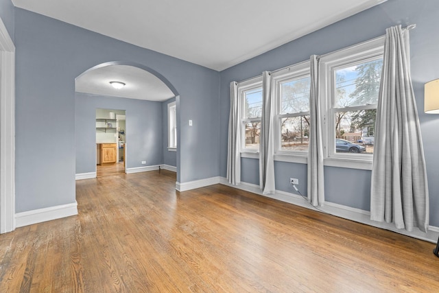 spare room with wood-type flooring